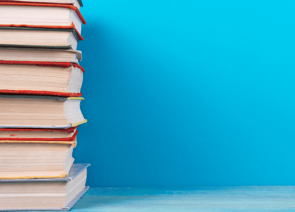Stack of books against a blue background